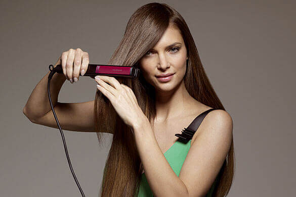 Utiliser un fer à lisser sur cheveux démêlés.