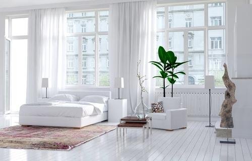 Chambre ou prédomine le blanc