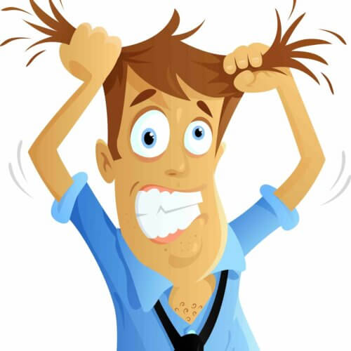 Un homme qui se tire les cheveux du stress.